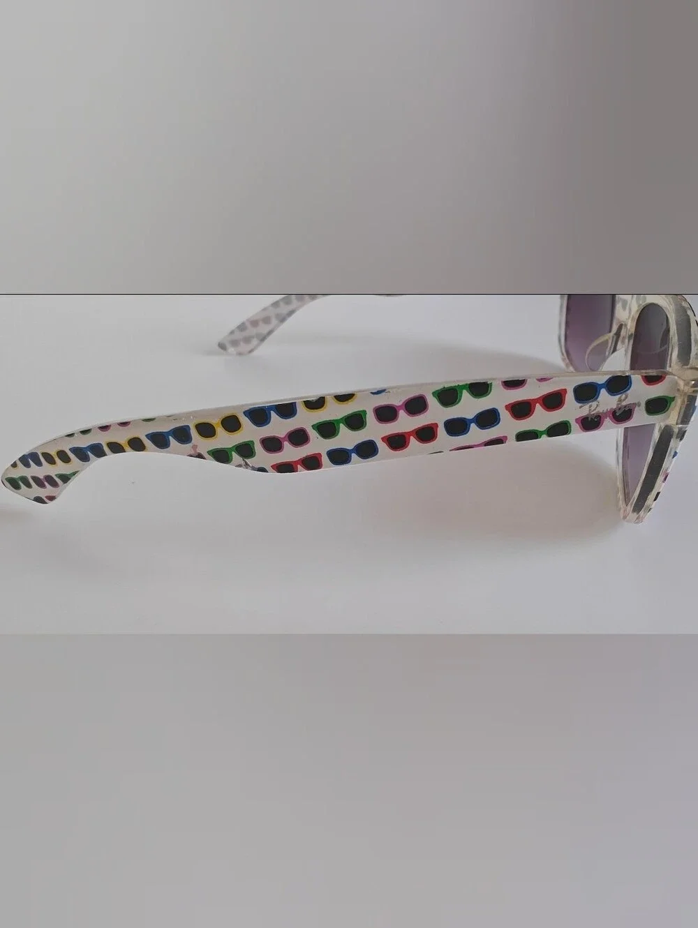 Ray-Ban Wayfarer Special Series #4 white frame covered in colorful sunglasses